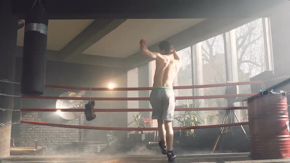 Young Sport Man dancing on the Boxer Ring