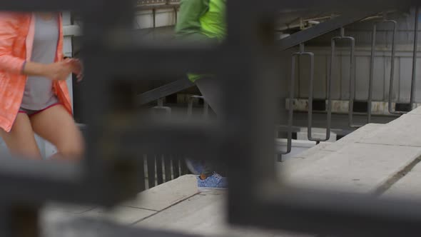 Multiethnic Female Joggers Running up Staircase