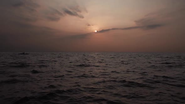 Fishing Boat And Birds At Sunset