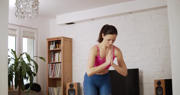Young Woman Doing Sports and Yoga at Home