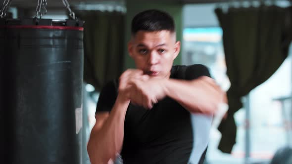 Young Man Shadow Boxing to a Camera