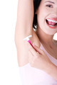 Smiling young woman shaving her armpit - PhotoDune Item for Sale
