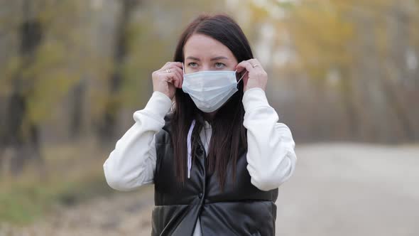 Young Woman Wearing Protective Medical Face Mask