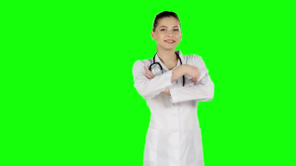 Female Doctor Smiling To Camera. Green Screen