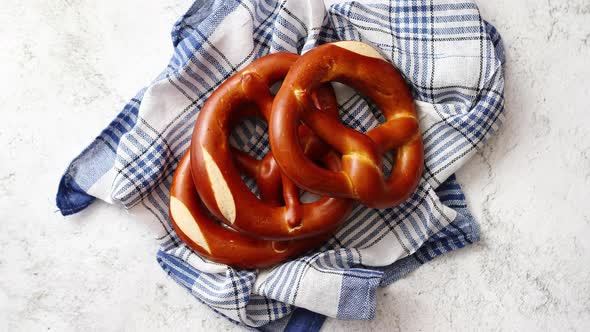 Three German Fresh Baked Pretzel Buns Placed on Napkin