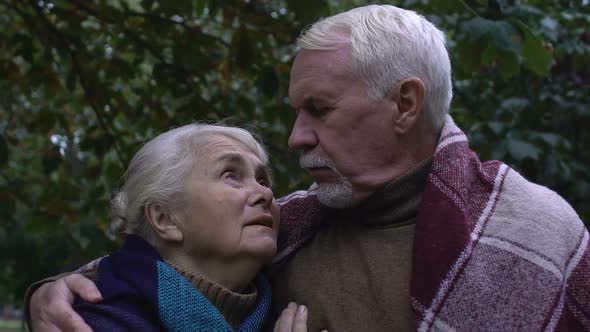 Mature Man and Woman Looking at Each Other With Hope and Trust, Close-Up