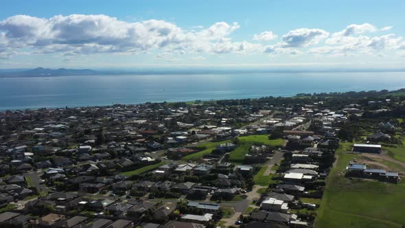 AERIAL Orbital Of Township Housing Estates Along Coastal Bay Waters