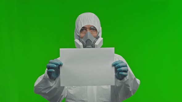 Male Doctor Virologist Scientist Man Wearing Protection Suit Respirator Glasses Gloves Holding Blank