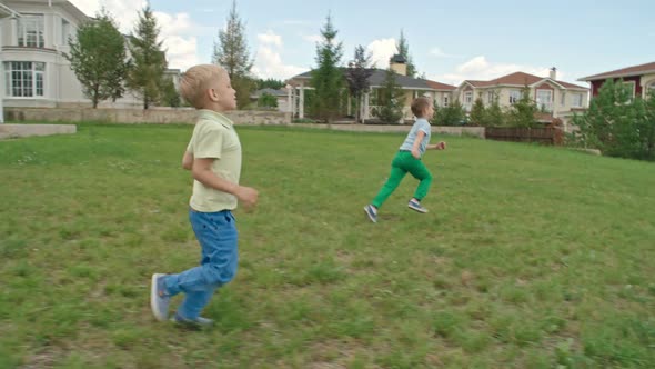 Playing Soccer on the Lawn with Father