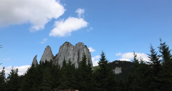 Blue Sky With White Clouds Over Piatra Singuratica Mountain Peak