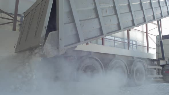 Dumper-truck unloading crushed rocks