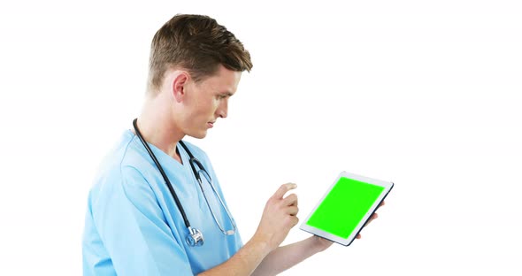 Male surgeon using digital tablet