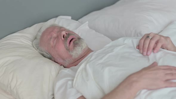 Old Man with Cough Laying in Bed