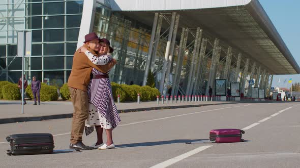 Senior Old Husband and Wife Retirees Tourists Reunion Meeting in Airport Terminal After Traveling