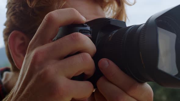 Closeup Photographer Hands Take Picture on Photo Camera