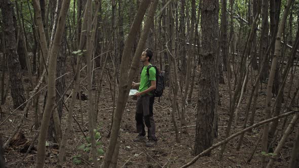 People with Backpacks Go Through the Forest Vacation and Camping Camp the Concept of Hiking