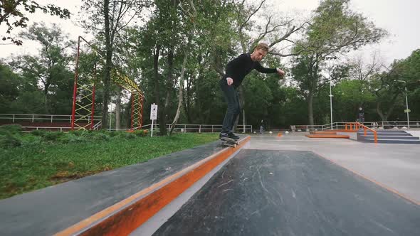 Skateboarder in Skate Park Doing Tricks Slow Motion