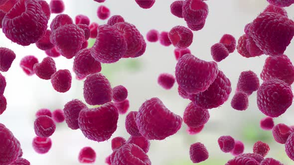 Raspberries Falling on Kitchen Background