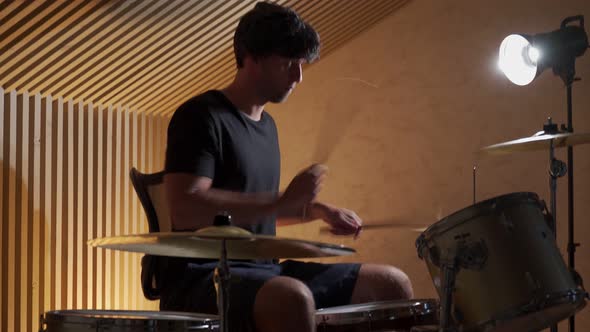 Drummer Playing His Drum Kit on Concert