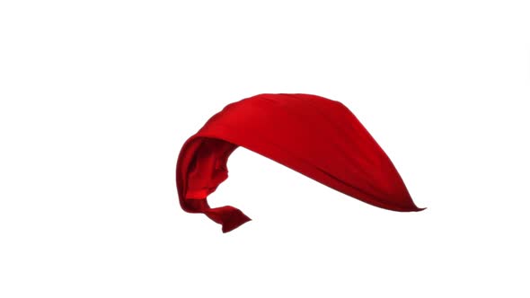 Red fabric flowing on white background, Slow Motion