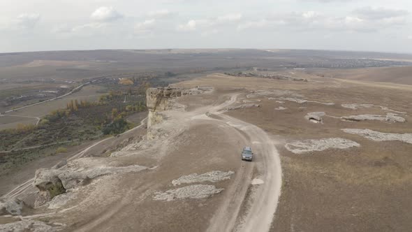 Suv Car Traveling on Mountain Plateau View From Flying Drone