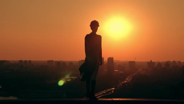 Female Architect in Hard Hat Scenic Town in Early Morning