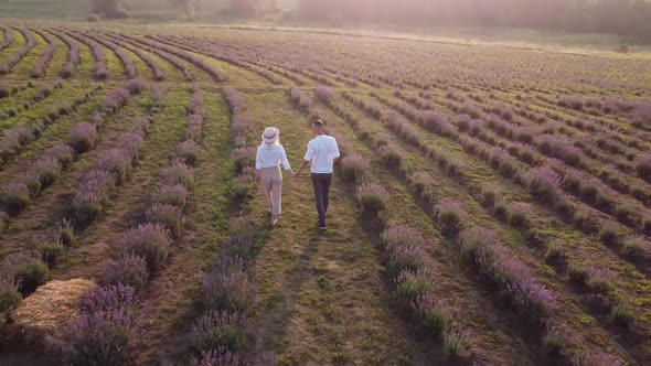 Beautiful Happy Couple on Purple Lavender Field Having Fun on Floral Glade Summer Nature Love