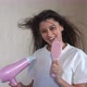 Female Drying Her Hair with Hairdrier Flying Hair - VideoHive Item for Sale