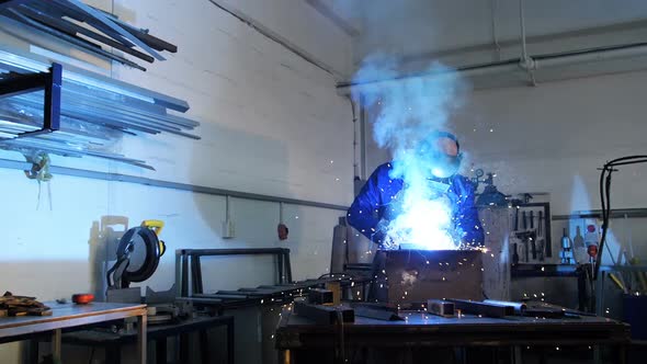 Welder welding a metal