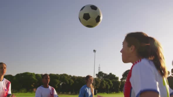 Side view of female soccer team training 4k