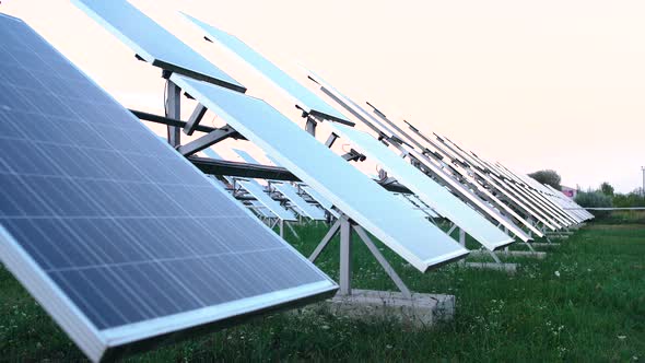 Solar Panels on the Background of a Village, Blue Sky. The Concept of Clean Energy, Green Energy