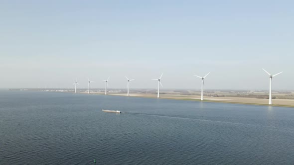 Aerial view Windmills on lake shore, Windfam in ijsselmeer lake, Netherlands