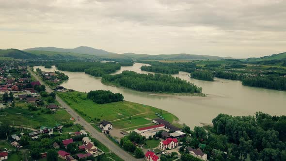 Aerial: Small Tourist City, Under the Clouds.