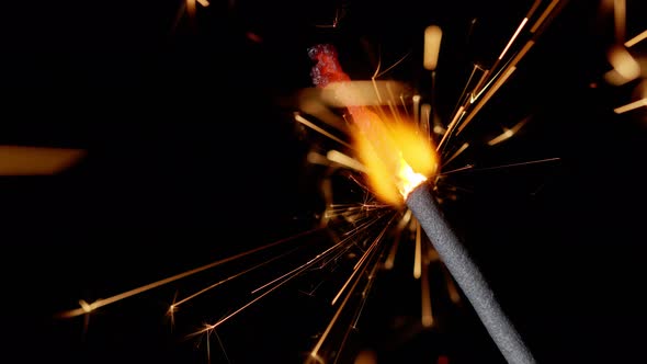 Bengal Fire Sparkling Lights Burning in Front of Black Background Closeup  Footage Slow Motion