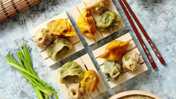 Delicious Mixed Kinds of Chinese Dumplings Served on Wooden Stands