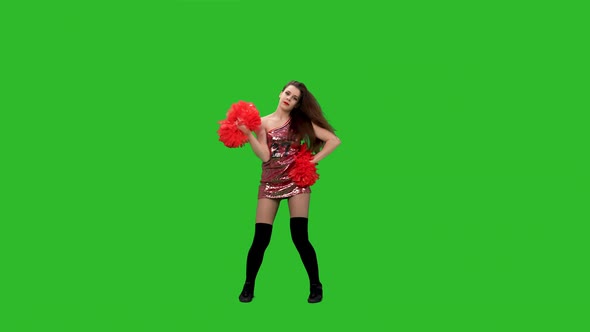Longhaired Cheerleader Performs Poppong Elements While Training in the Studio on a Green Screen