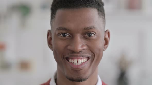 Close up of Face of African Man Smiling at the Camera