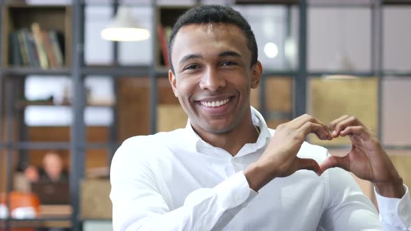 Heart Sign by Black Man