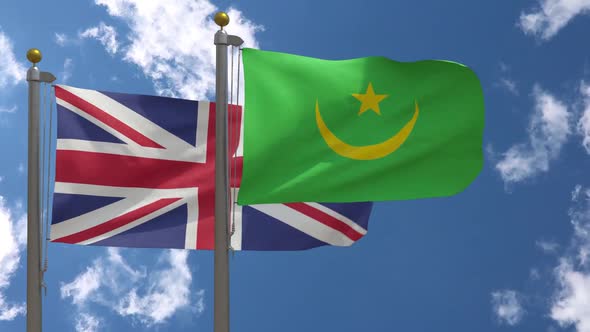 United Kingdom Flag Vs Mauritania Flag On Flagpole