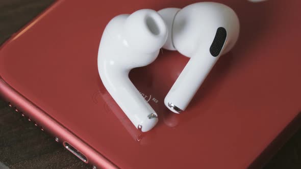  Wireless Headphones , on a Red Telephone, Close-up.