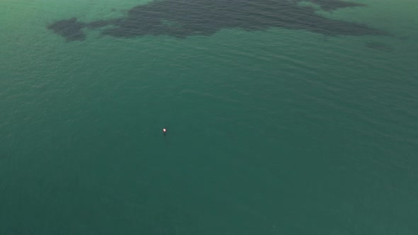 Tourists Swim At Calm Blue Waters Of Atlantic Ocean In Keem Beach, Ireland. - aerial