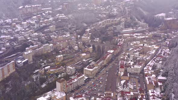 Beautiful historic small town during winter. Saint-Claude, Jura. Aerial birds eye view of popular tr