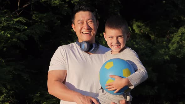 Close Up View of Happy Multicultural Sports Family at Sunset