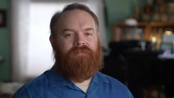 Face of man with red hair and beard with sad eyes