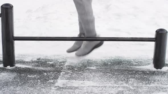 Legs of Man Doing Cardio Workout Outdoor in Winter