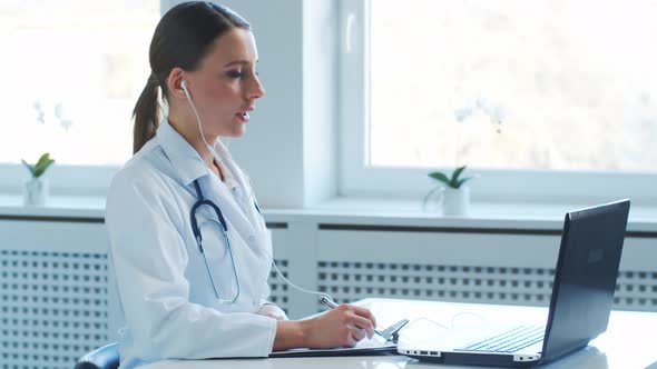 Professional medical doctors working in hospital office making research.