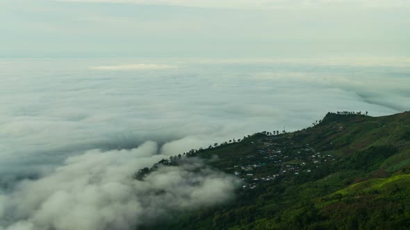 Fog Moving Above Village In Mountain