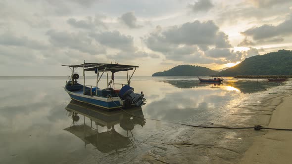 Timelapse reflection of boat from day to night