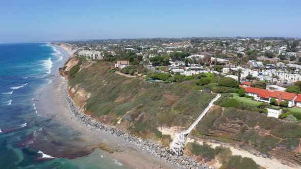 Aerial shot of seafront houses on a cliff in Encinitas California, USA.