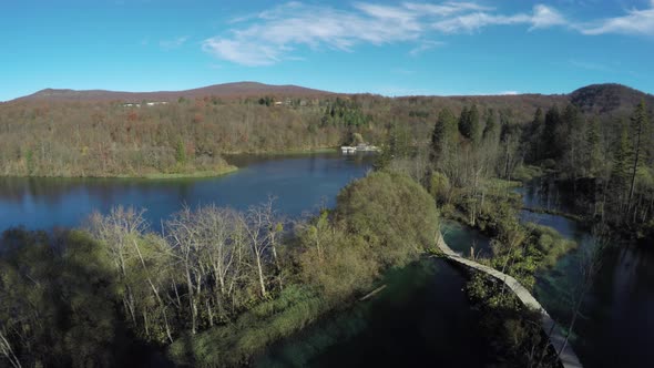 Aerial of lakes, forested hills and bridges, Plitvice